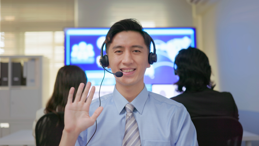 Customer service rep working in collaboration with AI in outsourcing.
